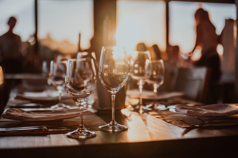 a dining table with wine glasses